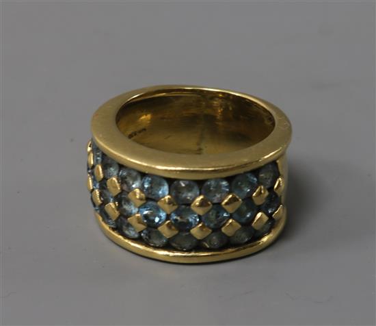 An 18ct gold and blue topaz? pave set ring, size L.
